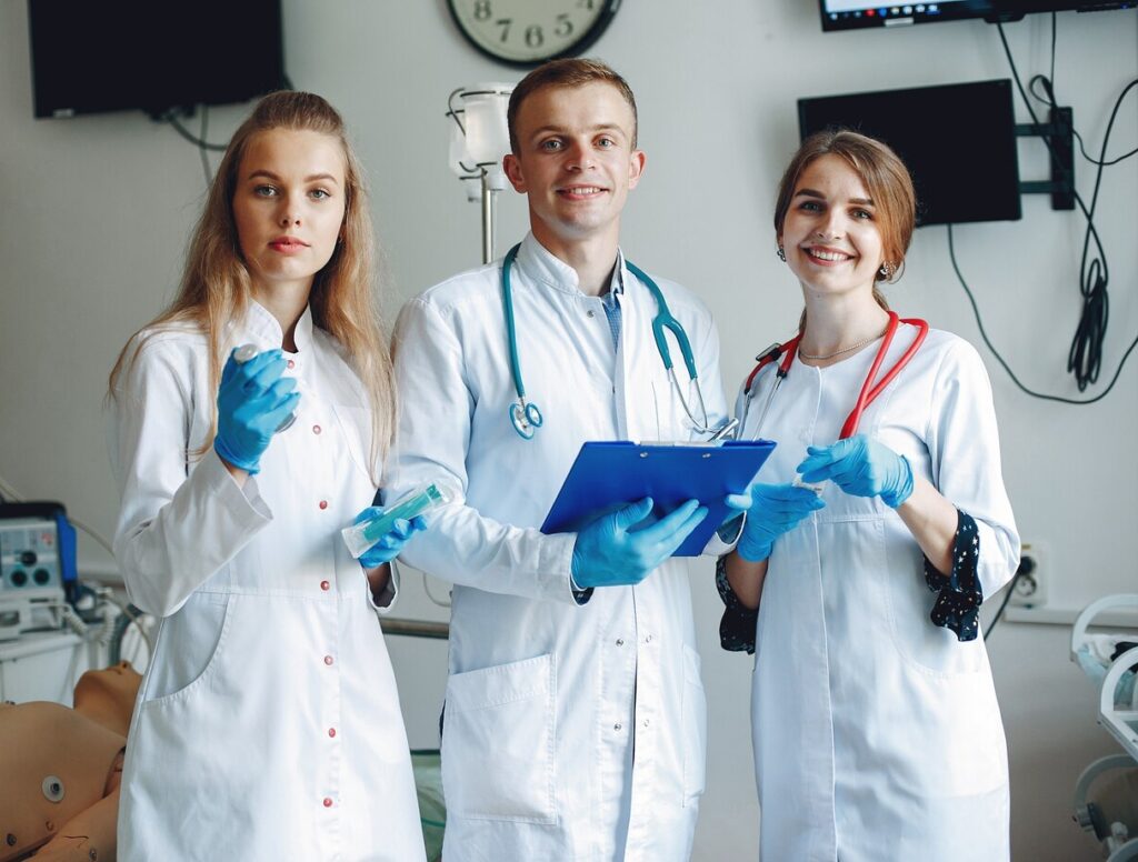 men-women-hospital-gowns-hold-medical-equipment-their-hands_1157-41713
